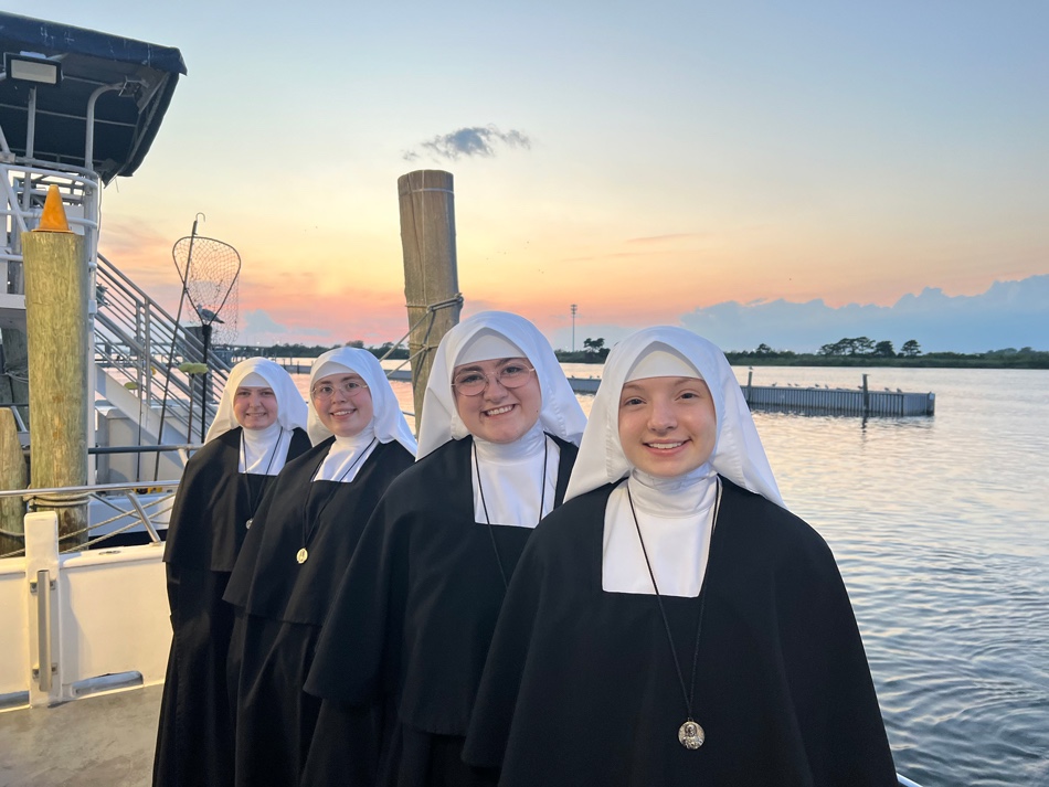 Novices at sunset near the water